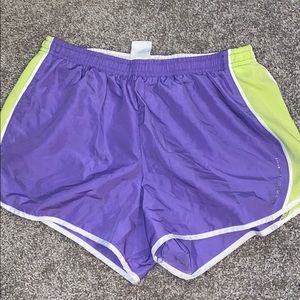 Green with purple athletic shorts